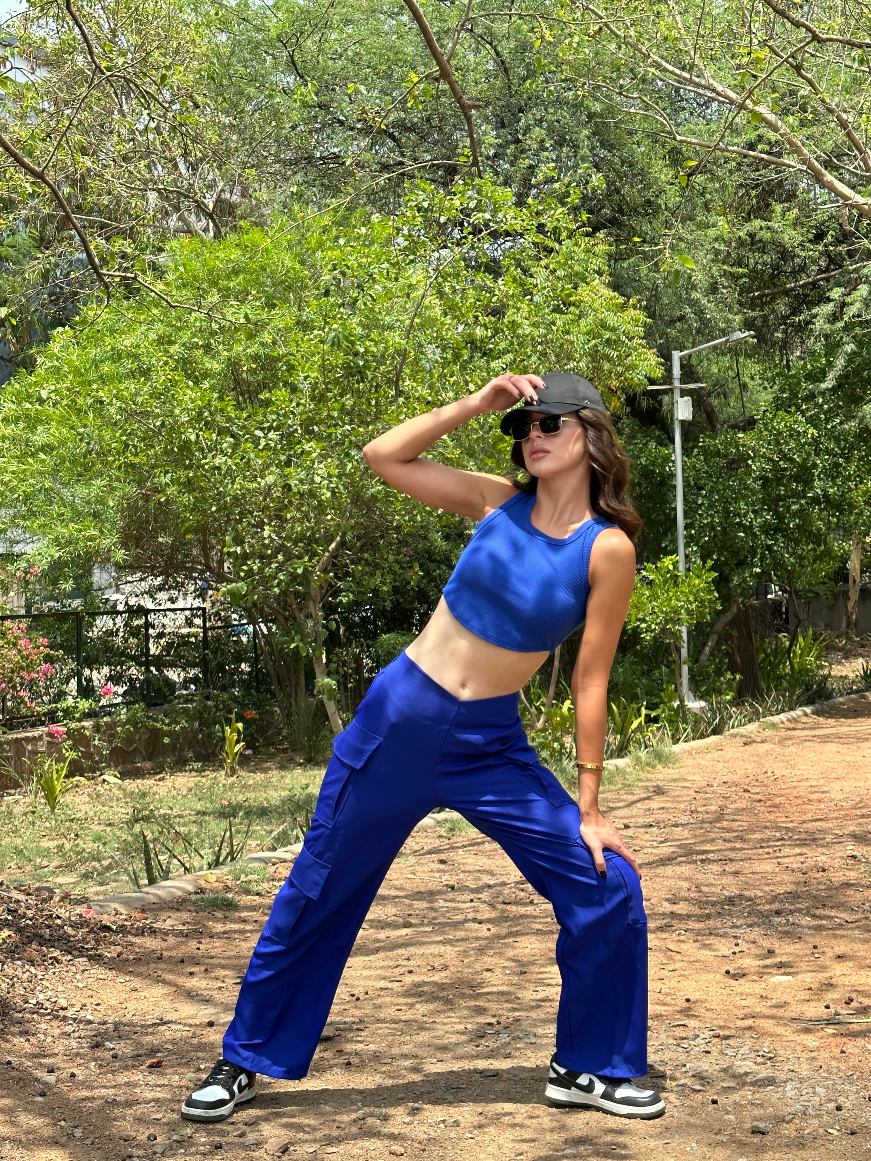 Hina Khan in mesh crop top and cargo pants, poses fearlessly with a snake.  Pics | Fashion Trends - Hindustan Times